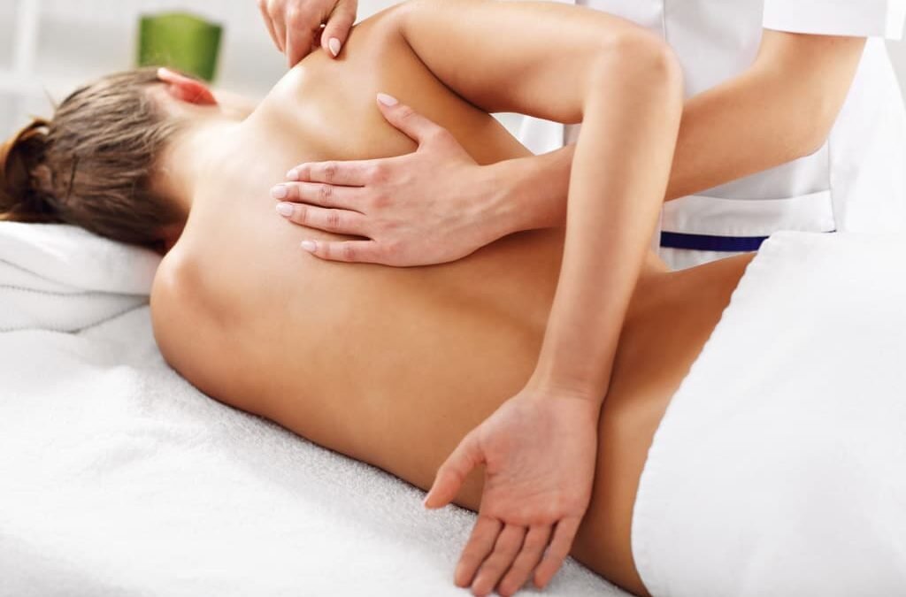 A woman receiving a massage at a spa.
